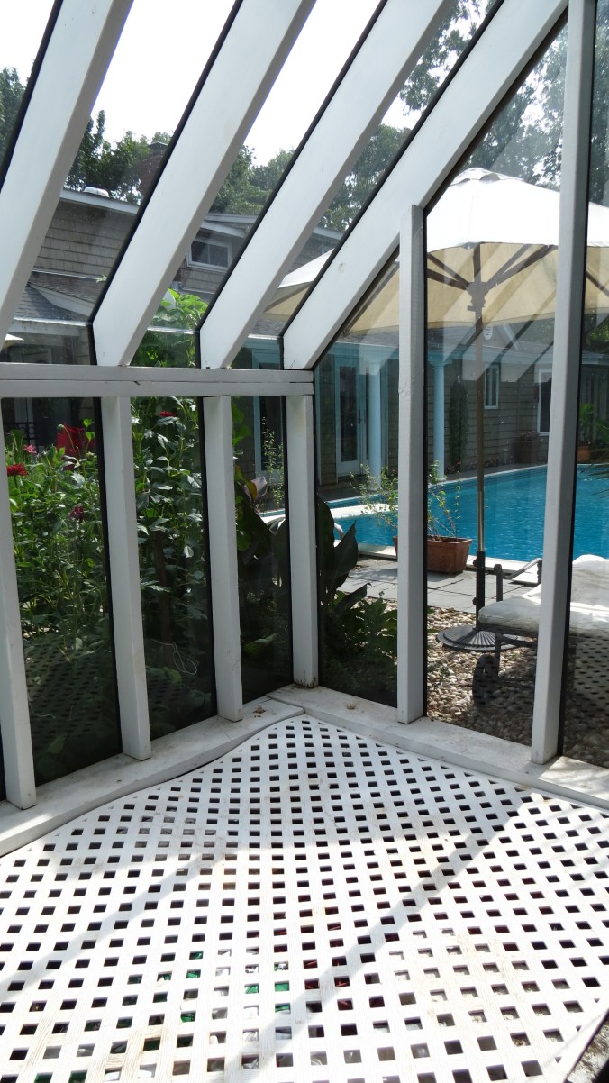 This is the seed starting area. Beginning in February, heat mats are placed on the lattice so seeds can receive bottom heat. Beneath the lattice is a floor of rocks and stones for drainage purposes.