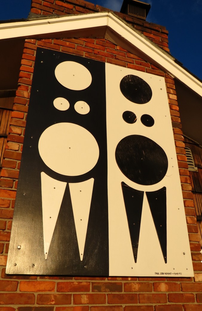 One of the largest pieces of Paul's art is mounted to the outside wall of the brick fireplace.  It has a commanding view of Laura's garden and the Long Island Sound.